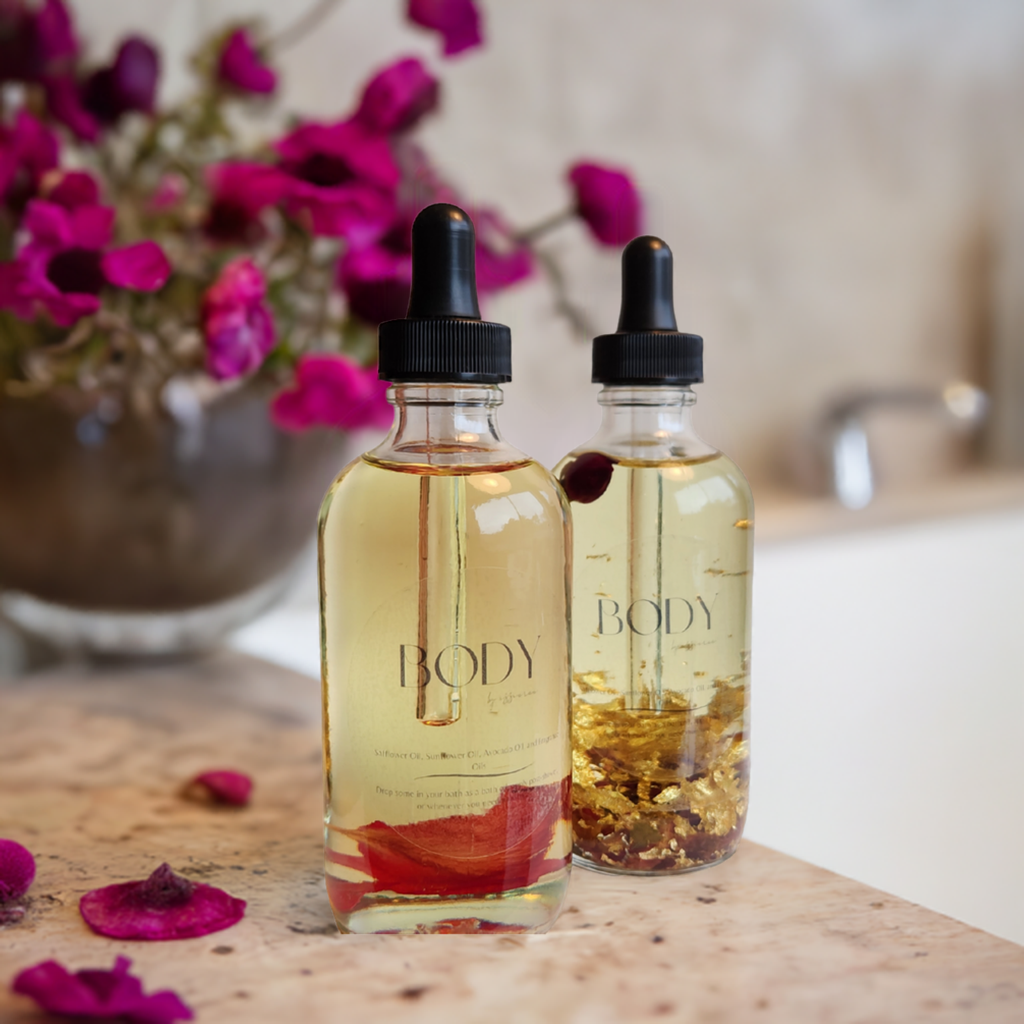 4oz Fragranced body oil in a dropper bottle by a tub